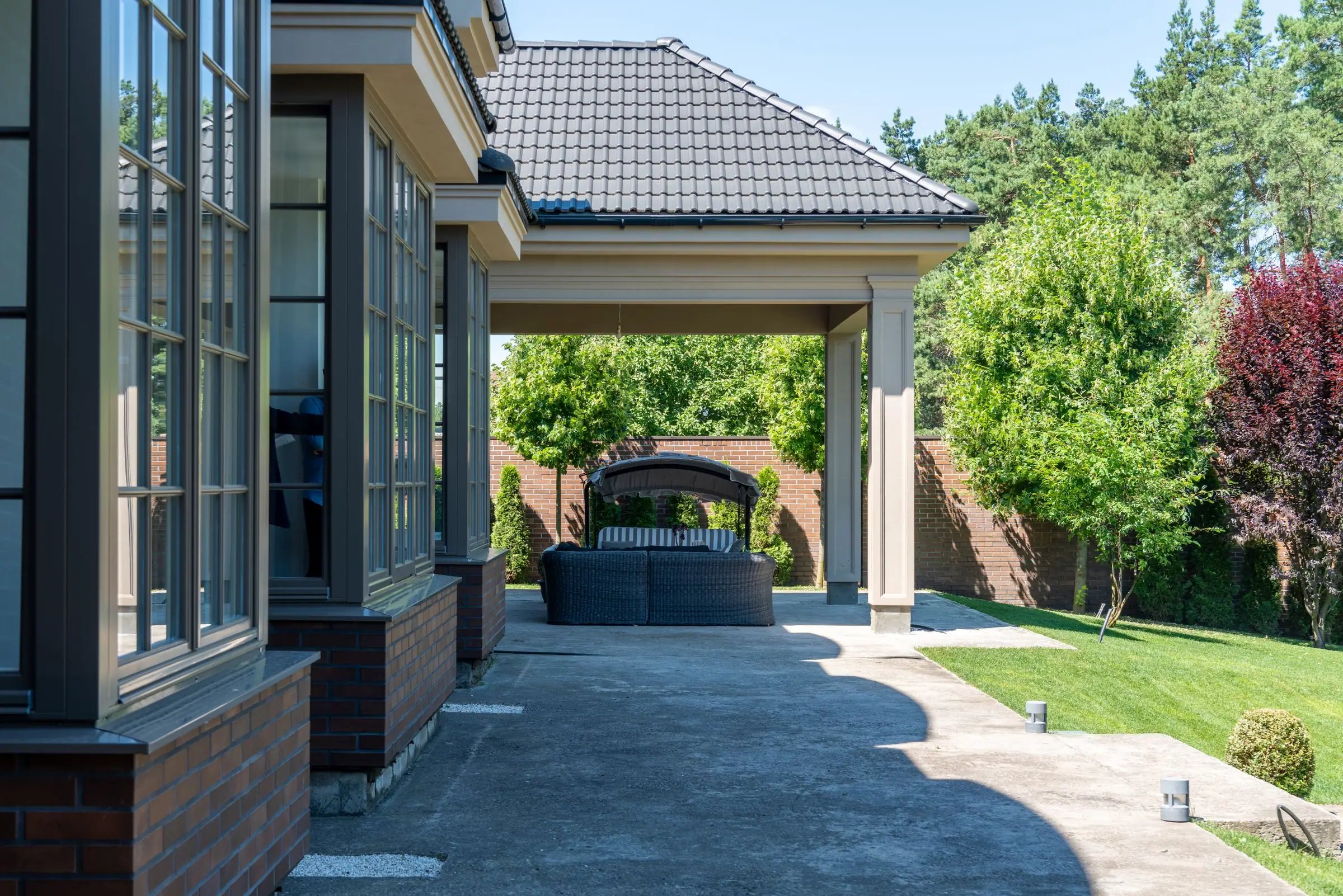 Patio cover attached to the back of a house over a seating area